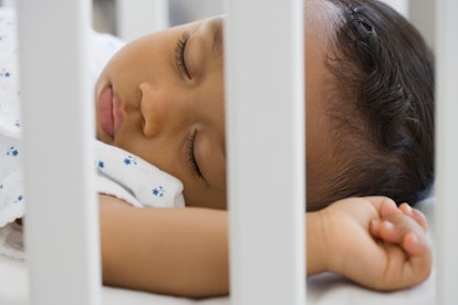 closeup of baby sleeping soundly in crib