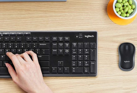 Hand typing on computer keyboard