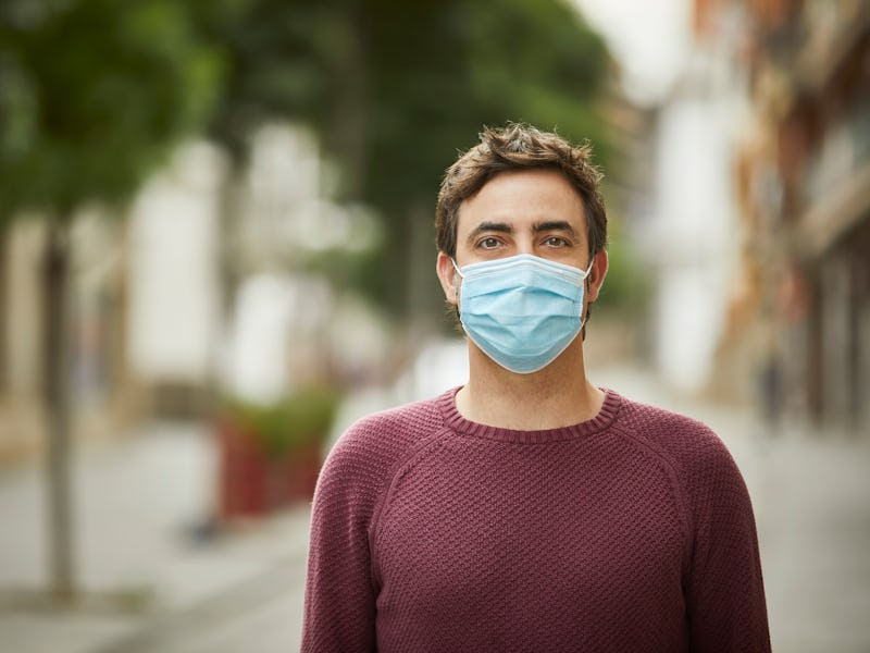 Man wearing a mask on the street.