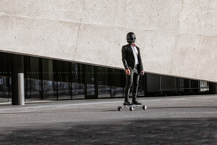 A person in a helmet riding a Hunter Board