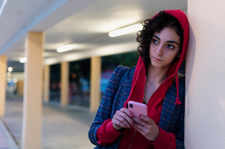Secretive woman texting
