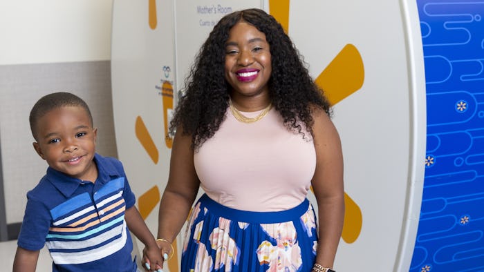 tennille webb and her son in front of walmart pod