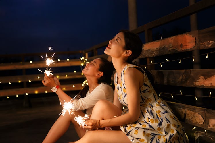 2 young women with fireworks