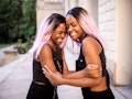 Twin sisters with pink hair