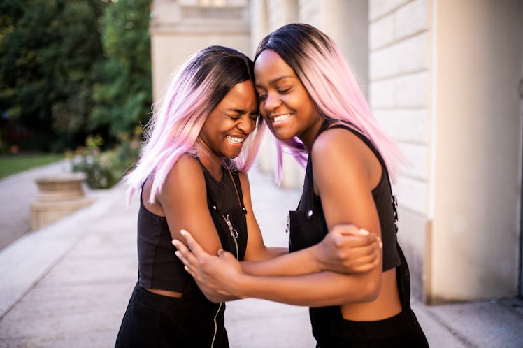 Twin sisters with pink hair