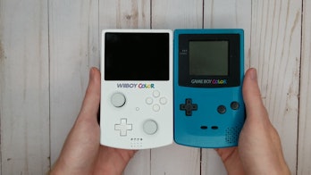 A photo of the WiiBoy Color and the Game Boy Color side by side.