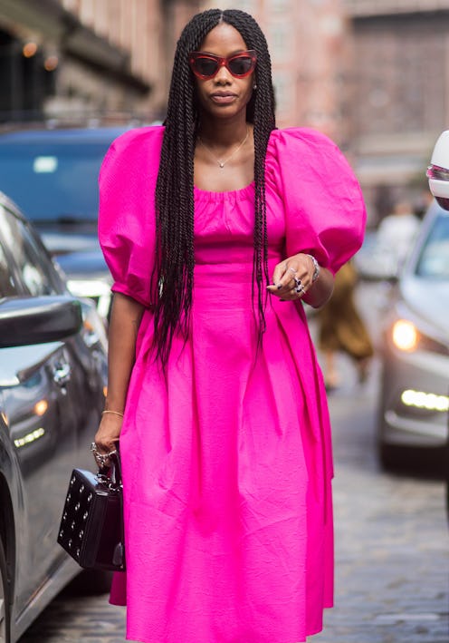 Editor wears pink dress at Fashion Week
