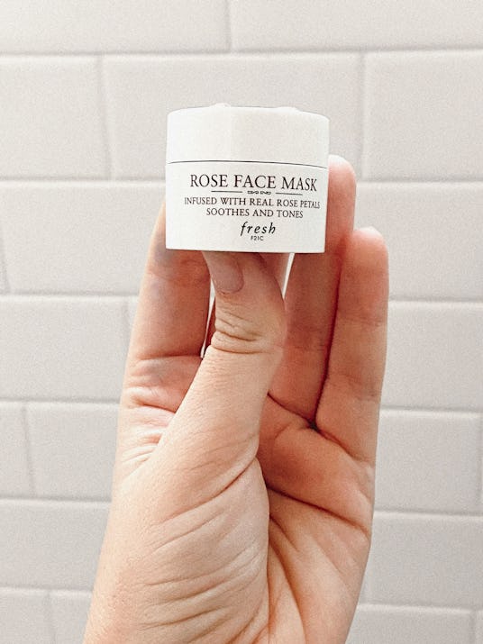 A hand holding Rose Face Mask product