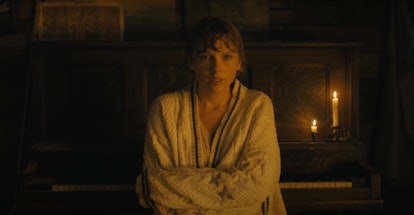 Taylor Swift wraps herself up in her favorite, knit cardigan in her "cardigan" music video.