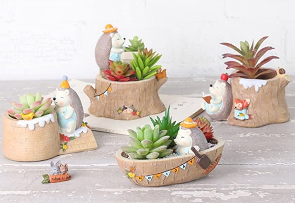 These miniature succulent pots with tiny animals are sure to brighten your day.