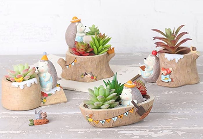 These miniature succulent pots with tiny animals are sure to brighten your day.