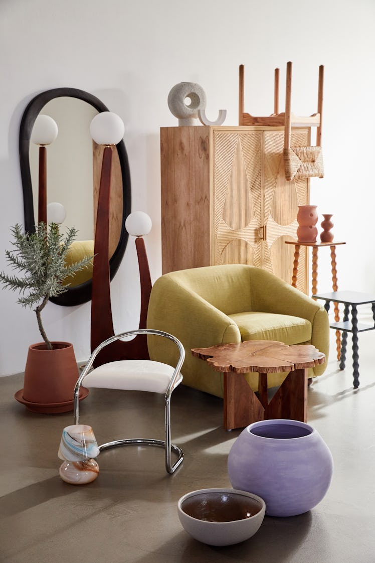 A variety of neutral-colored furniture takes up a bright room.