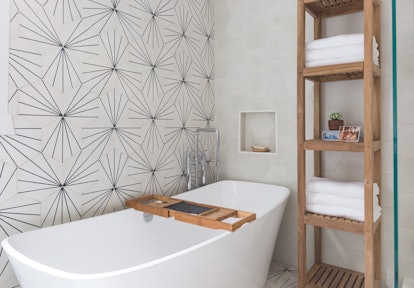 You can refresh your bathroom for summer by adding fresh towels, pretty soap dishes, and more