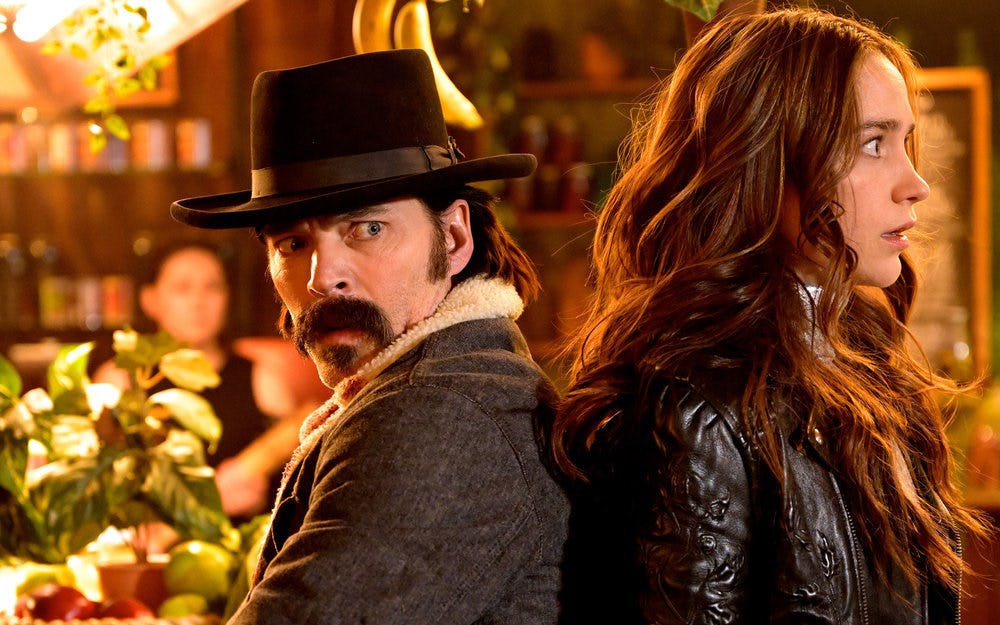 Tim Rozon as Doc Holliday, Melanie Scrofano as Wynonna Earp in Season 4