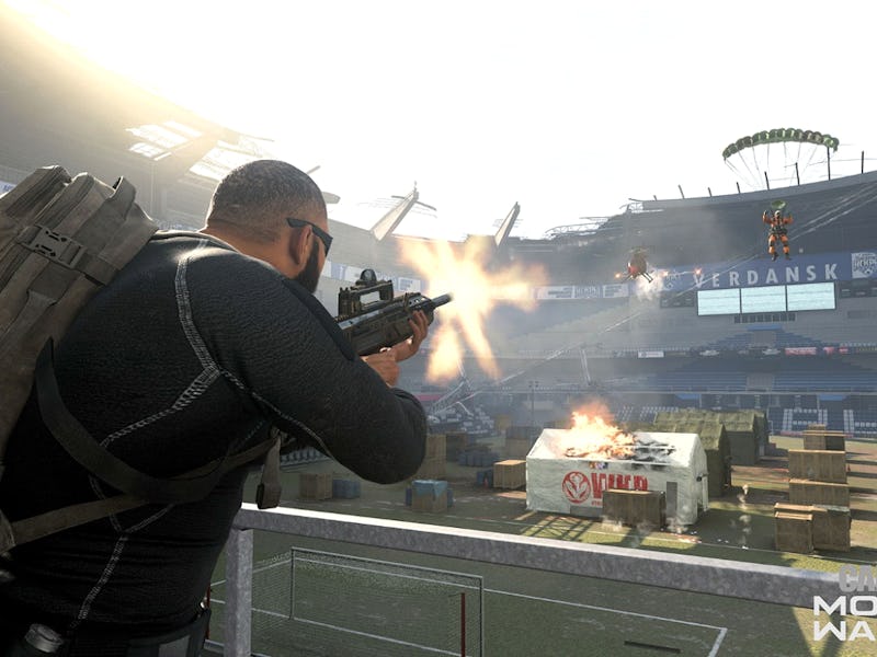 A character in Warzone season 5 shooting from a gun at a stadium