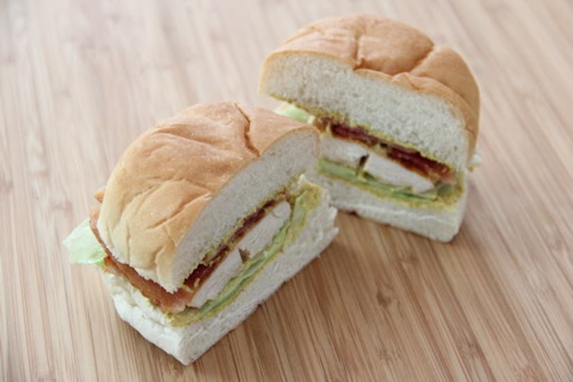 Chicken sandwich on a roll cut in half