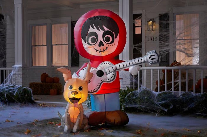 This Coco Halloween inflatable yard decoration features characters Miguel and Dante.