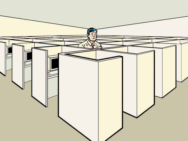 Man looking up from his cubicle.
