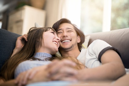 Young couple smiling on couch