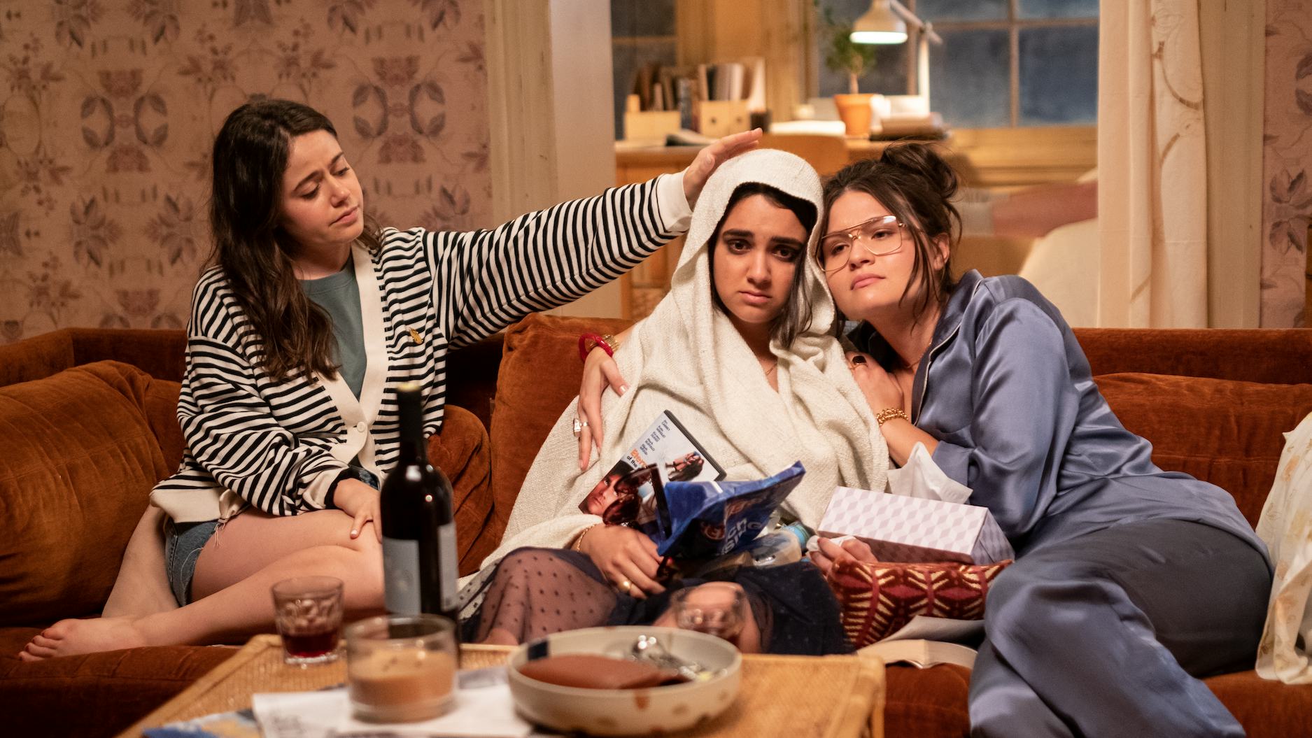 Amanda (Molly Gordon) and Nadine (Phillipa Soo) try to help Lucy (Geraldine Viswanathan, center) fee...