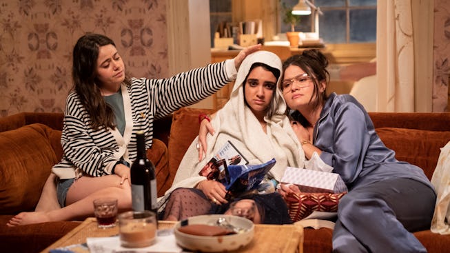 Amanda (Molly Gordon) and Nadine (Phillipa Soo) try to help Lucy (Geraldine Viswanathan, center) fee...