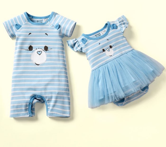 An image of a blue onesie with a Care Bear face on the front and tutu attached beside a larger blue ...