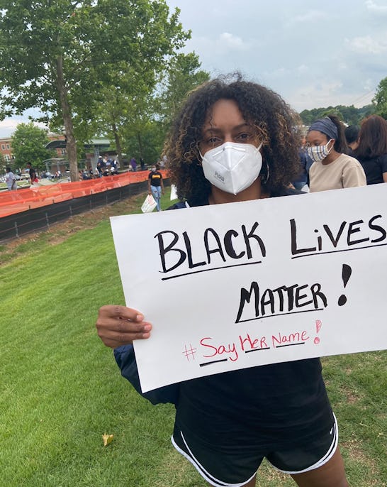 Myra Lee at a protest earlier this year holding a Black Lives Matter poster