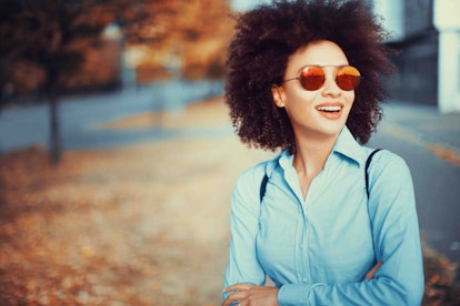 Young woman wearing sunglasses in autumn
