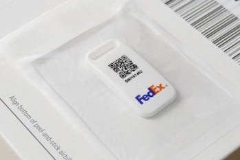 The SenseAware ID, a Bluetooth tracking device, on a FedEx package.