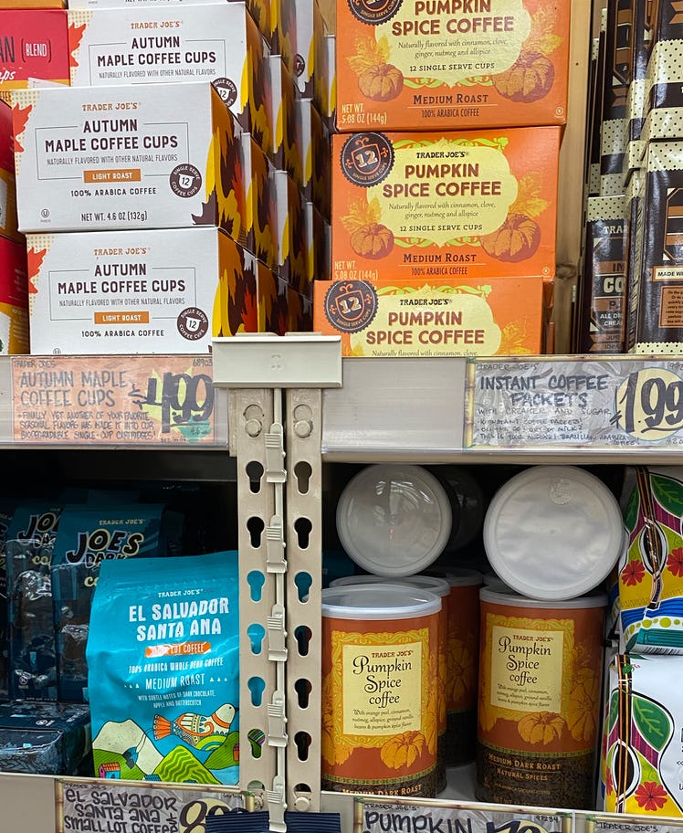 Shelves full of a variety of fall flavored coffees and coffee pods.