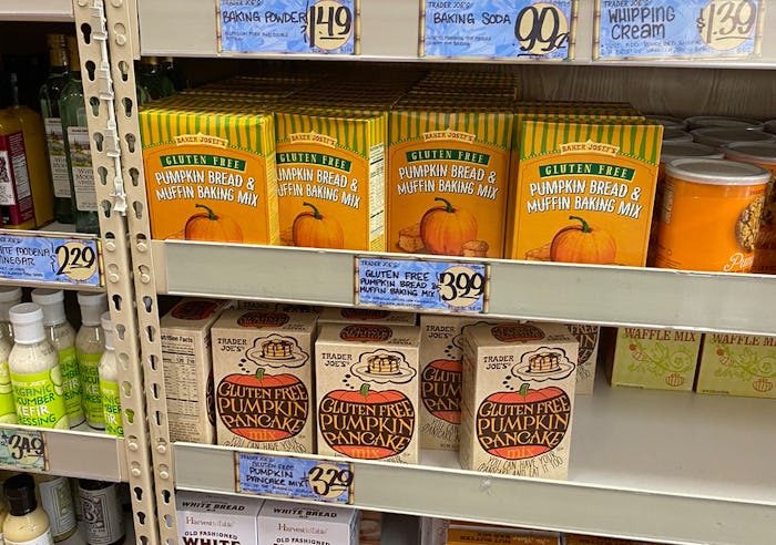 A picture of a semi-empty Trader Joe's shelf with gluten free pumpkin pancake mix.