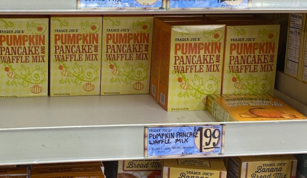 An image of pumpkin flavored waffle mix boxes on a shelf.