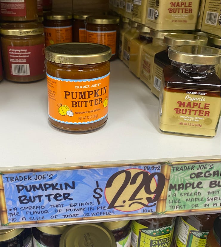 An image of a line of jelly jars, with pumpkin butter front and center.