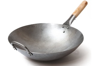 Perfect for stir fry, this pan for high-heat cooking is a wok made from hammered carbon steel.
