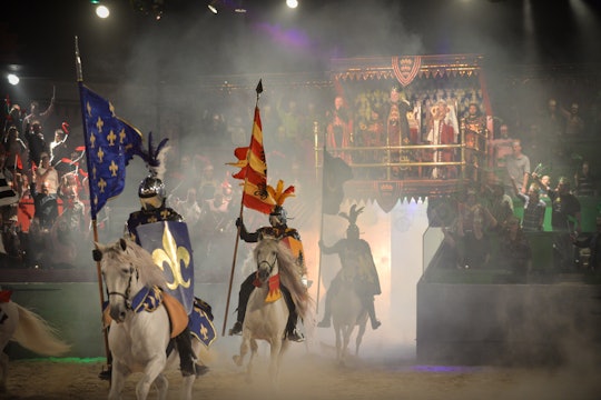 Knights riding in the arena at Mom 2.0, Medieval Times summit