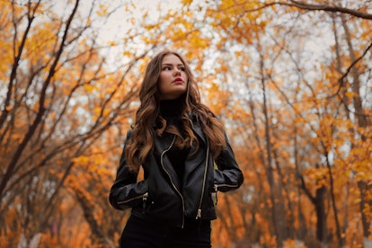 Young woman in leather jacket in autumn