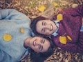 Twins in fall leaves