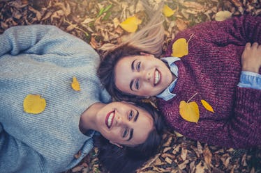 Twins in fall leaves