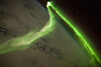An aurora from a geomagnetic storm that was most likely caused by a coronal mass ejection, observed ...