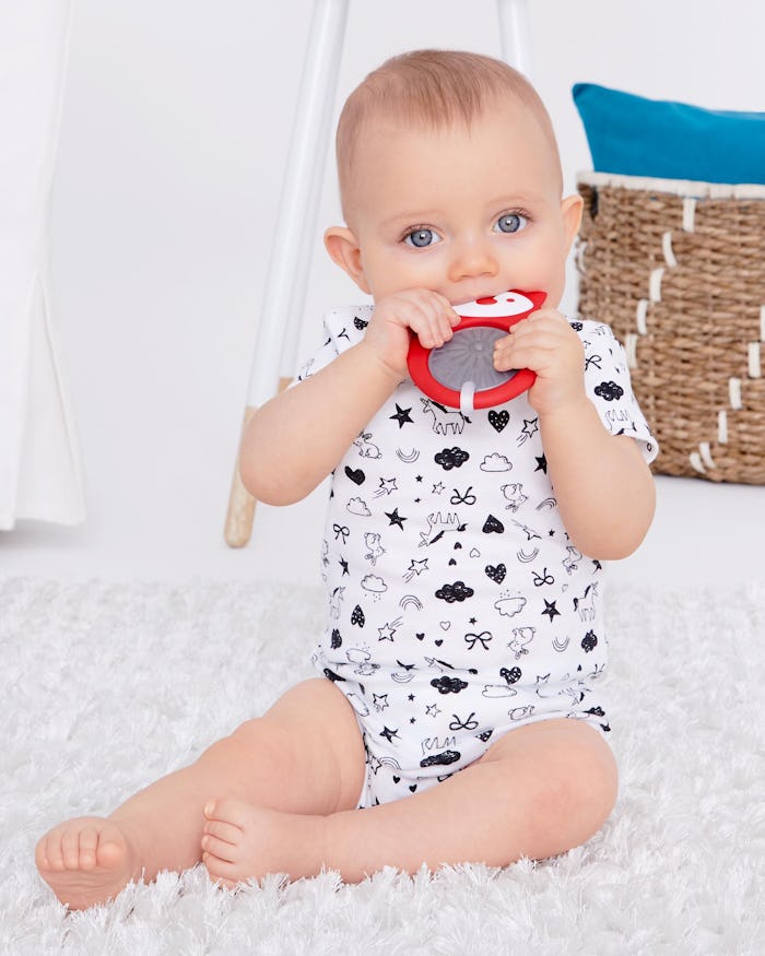 a baby with a skip hop teether