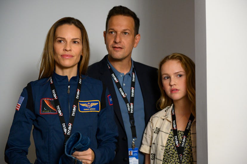 Hilary Swank as Emma Green, Josh Charles as Matt Logan, and Talitha Bateman as Alexis Logan in 'Away...