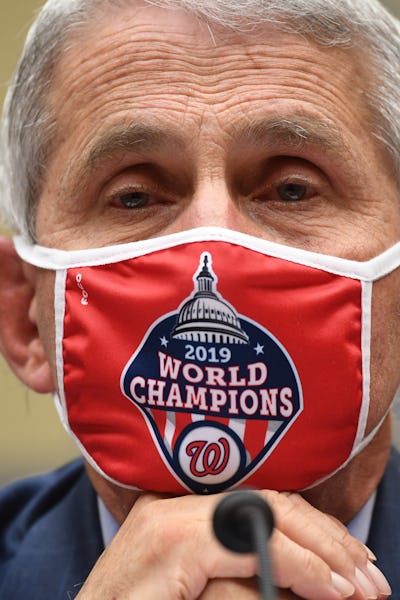 Anthony Fauci, wearing a red mask with a World Champions logo with a text box reading: 'I guess the ...