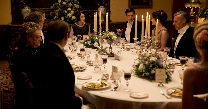The Crawley family sit around the Christmas dinner table