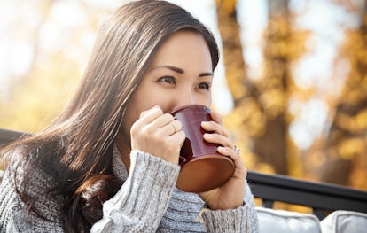 Young woman sipping coffee