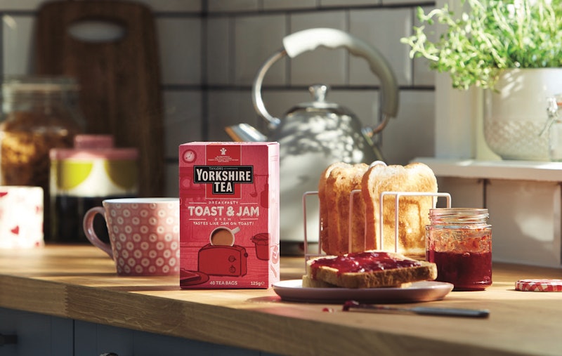 Yorkshire Tea's new jam and toast tea photographed next to a muck and a rack of toast with a plate o...