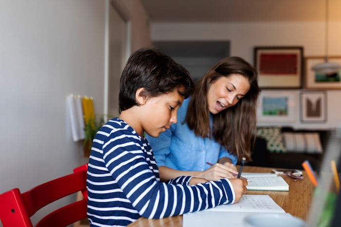 mother homeschooling son