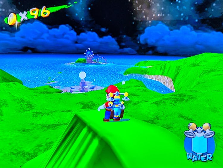 A still from Super Mario Sunshine that features Mario overlooking another island.