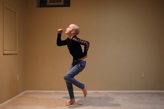 child with cancer dancing in her living room