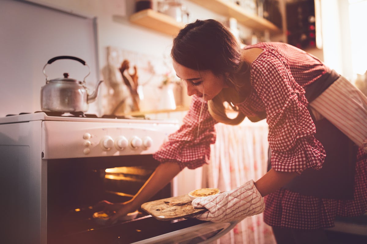Young woman baking pumpkin pie