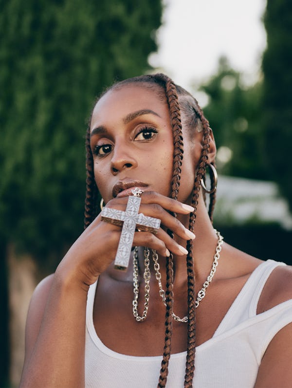 Issa Rae posing in a Kendra Duplantier top, Gucci necklace and Ben Oni earrings